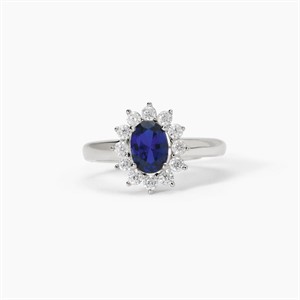 Anello in argento con zaffiro sintetico ovale e zirconi