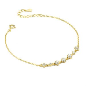 Bracciale dorato con con fiori definiti da zirconi